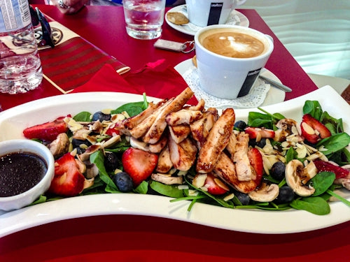 Grilled chicken salad with strawberries and blueberries